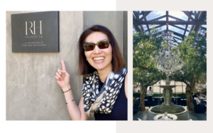 Interior of RH Yountville restaurant featuring oversized modern furnishings, crystal chandelier centerpiece, mature olive trees, and a luxury indoor-outdoor dining space with stone and glass architecture