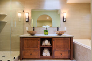 Award-winning Japanese-inspired bathroom designed by Yoko Oda Interior Design featuring natural wood, stone, and minimalist details